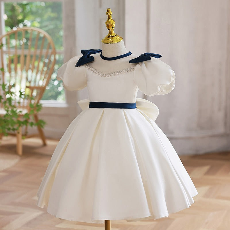 White Princess Tea Length Dress with Beaded Illusion Neckline & Bow | Special Occasion Girls Dress
