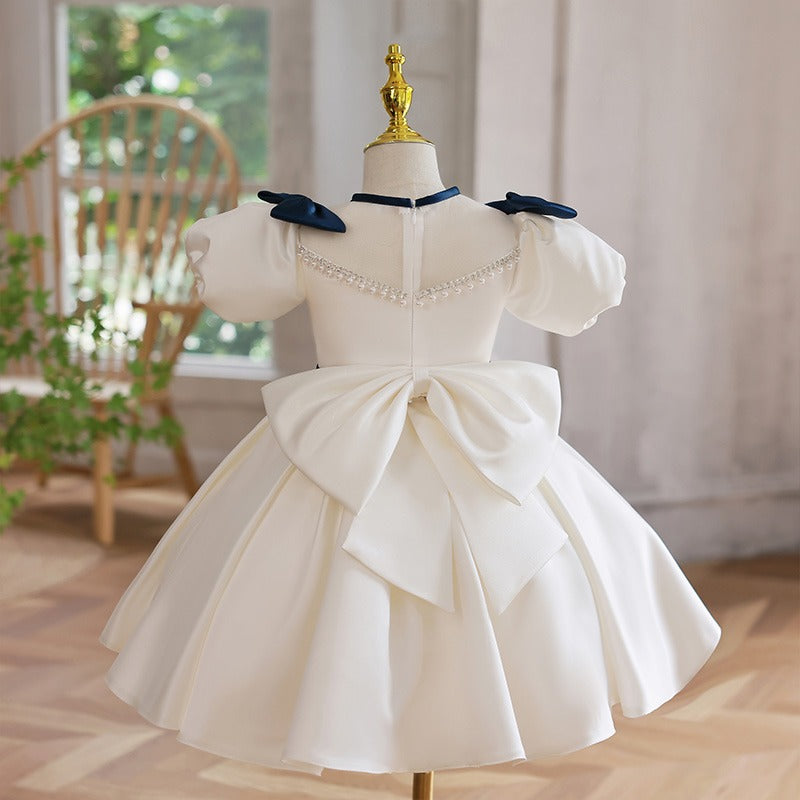 White Princess Tea Length Dress with Beaded Illusion Neckline & Bow | Special Occasion Girls Dress