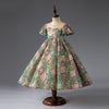 Robe de demoiselle d'honneur verte à sequins : manches bouffantes jusqu'au sol